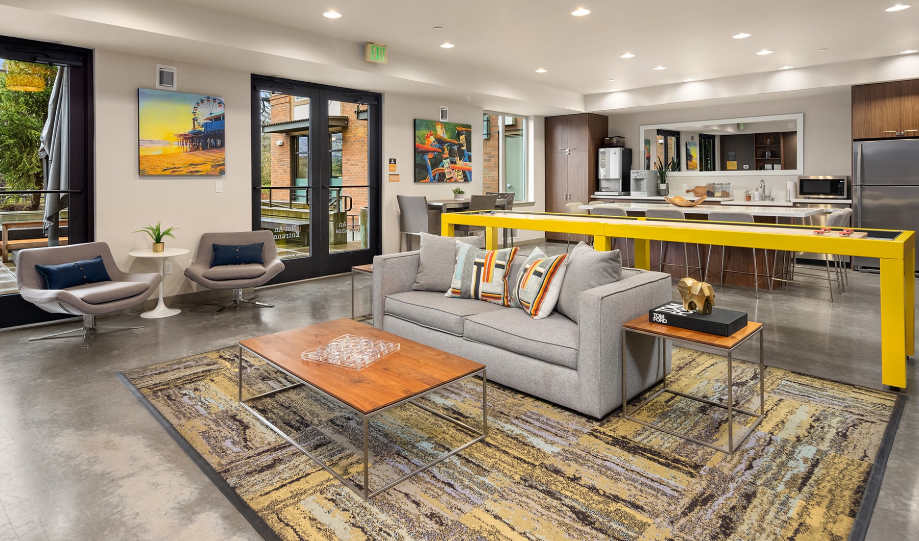 The (104) Amenities Amenity lounge with shuffleboard & kitchen.